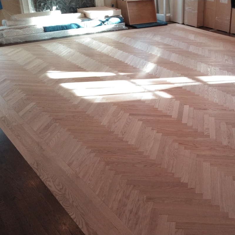 Unfinished Red Oak Herringbone with boarder installed into existing flooring.